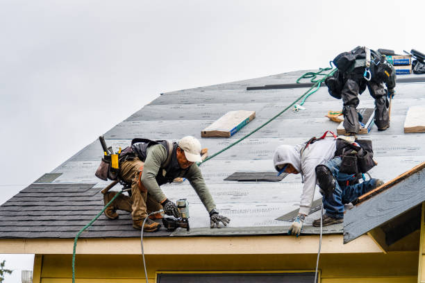Professional Roofing technician working in Russell, IA